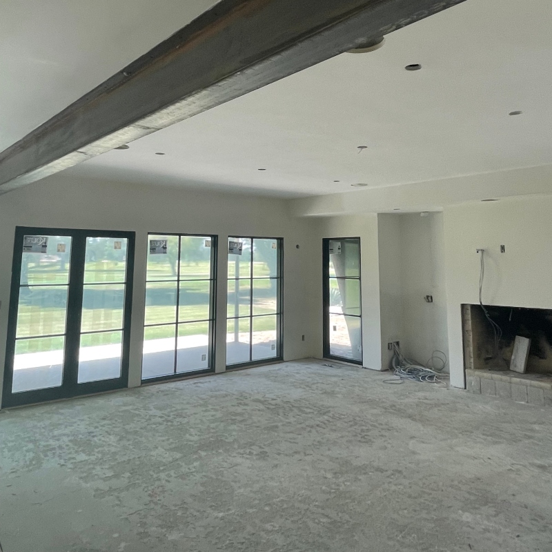 Before and after images of a drywall installation project, demonstrating the dramatic impact of professional workmanship