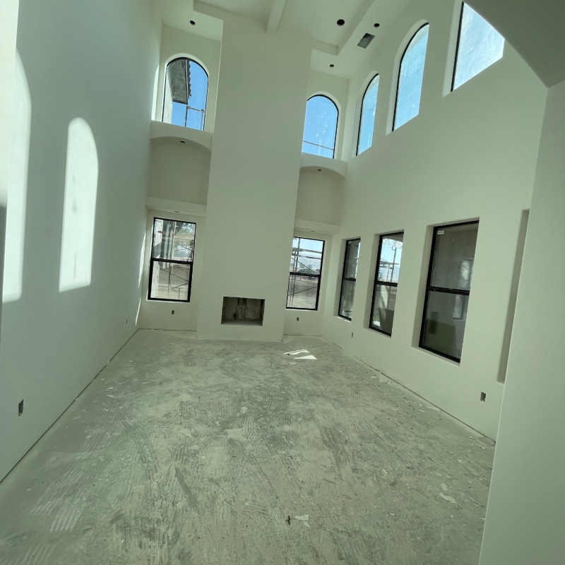 Drywall installation in progress, showing different stages of completion