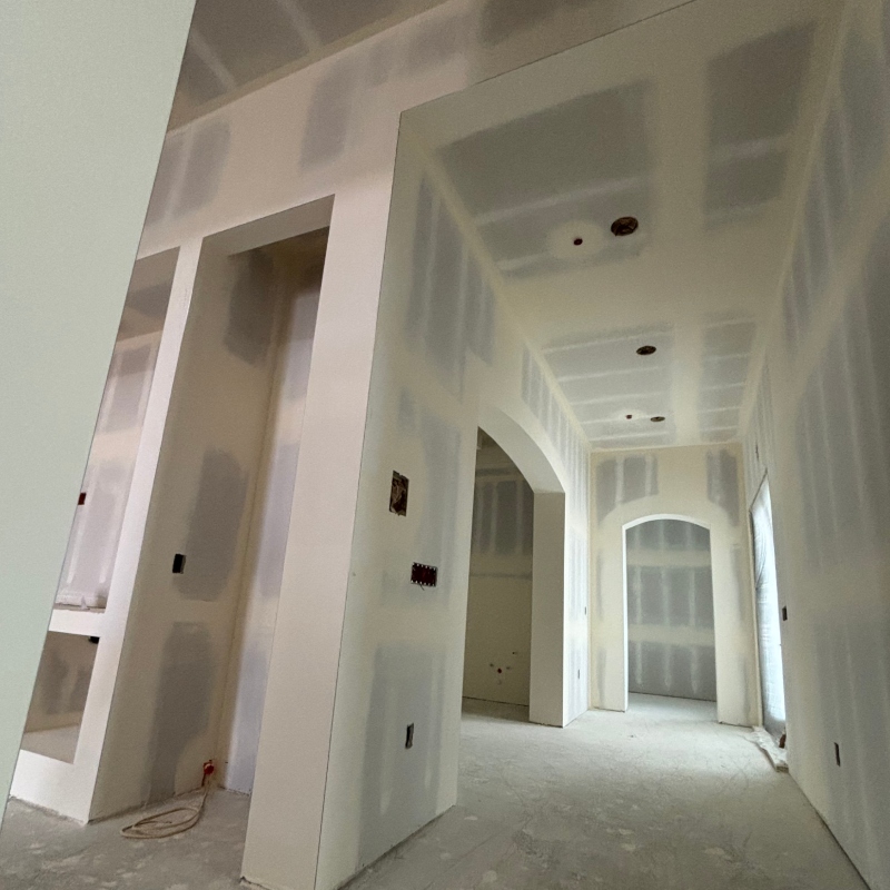Before and after images of a drywall installation project, demonstrating the impact of professional workmanship