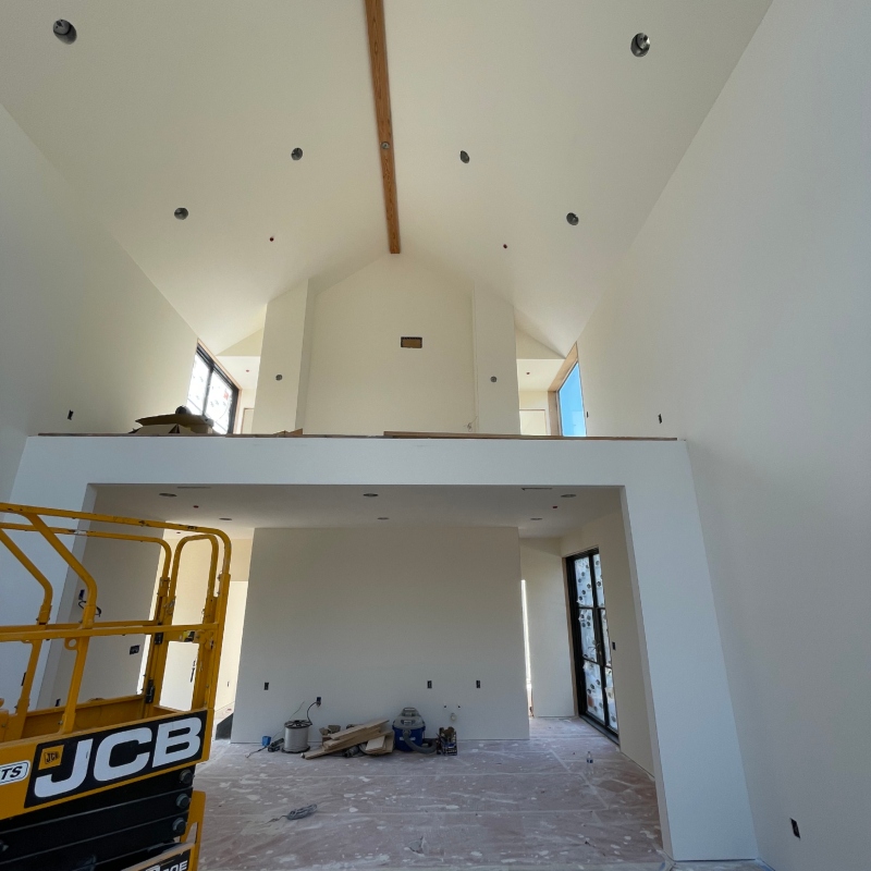 Drywall installation highlighting the process of transforming a room with smooth, finished surfaces